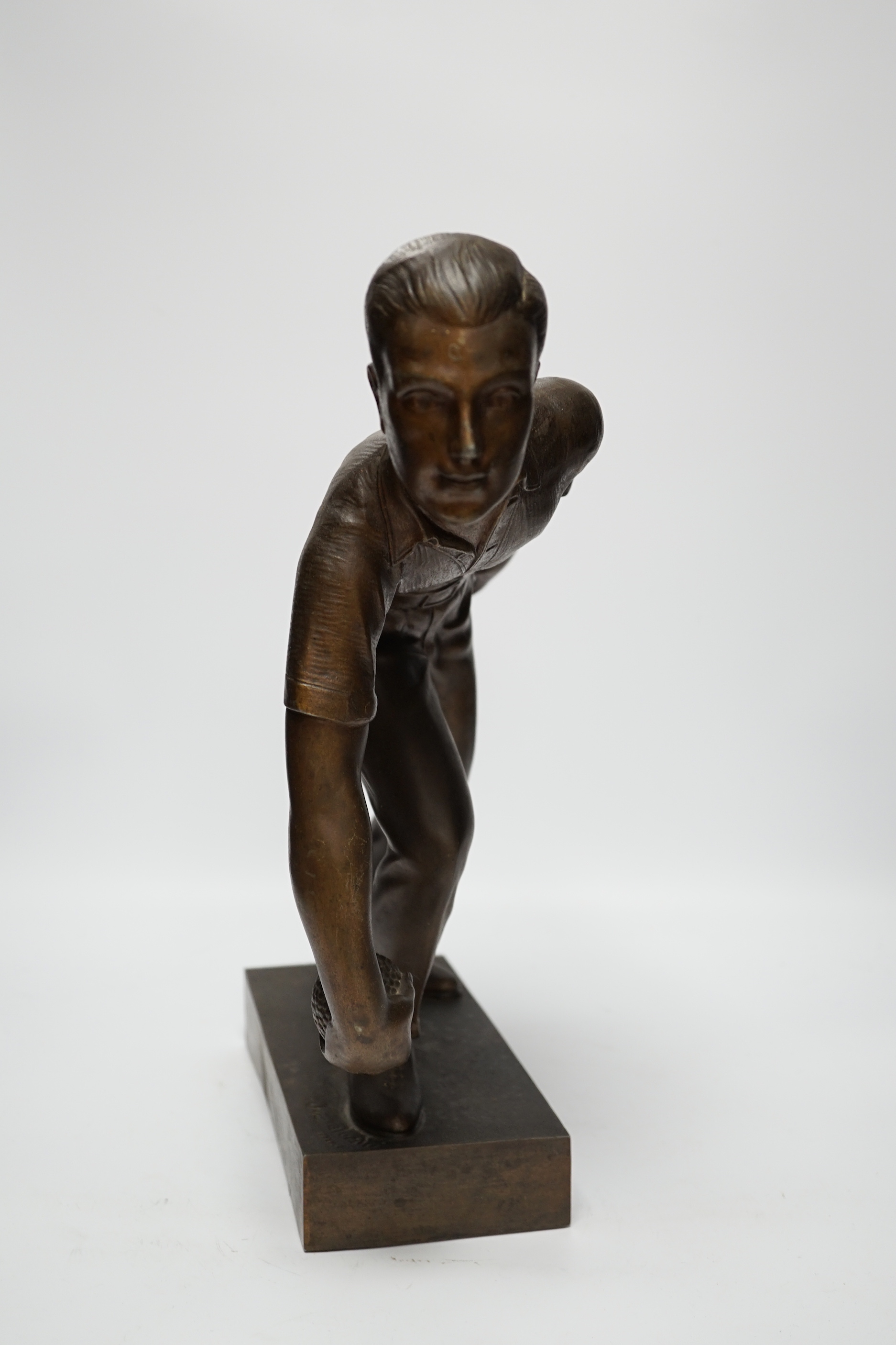 A bronzed spelter figure of a boule player, signed Fugere, 40cm high
